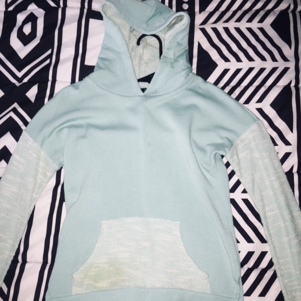 A light blue long sleeve with a hoodie